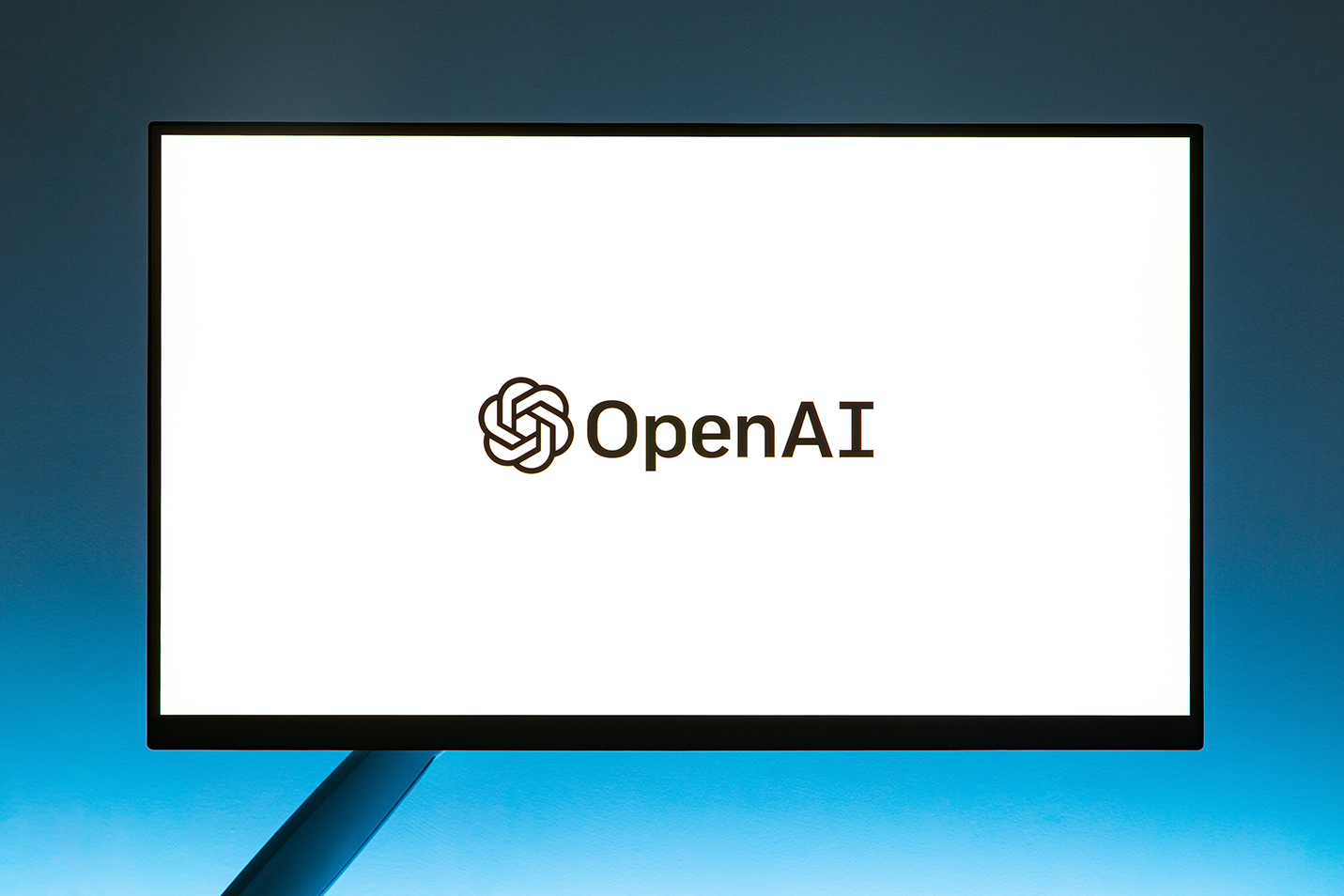 Monitor screen displaying OpenAI logo