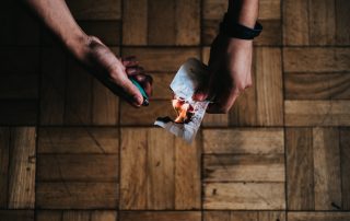 person burning paper