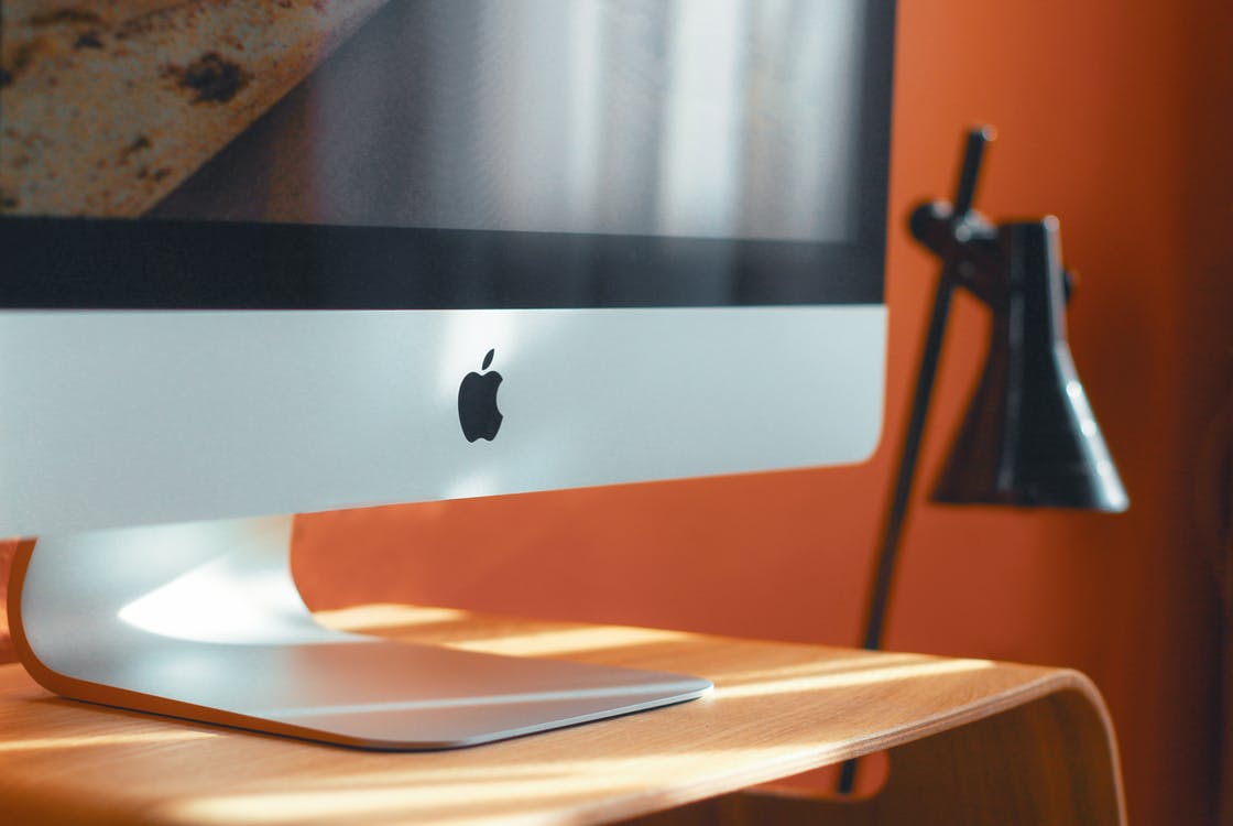 A Mac Computer Sits on a Desk