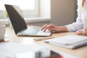 A woman works from a laptop computer